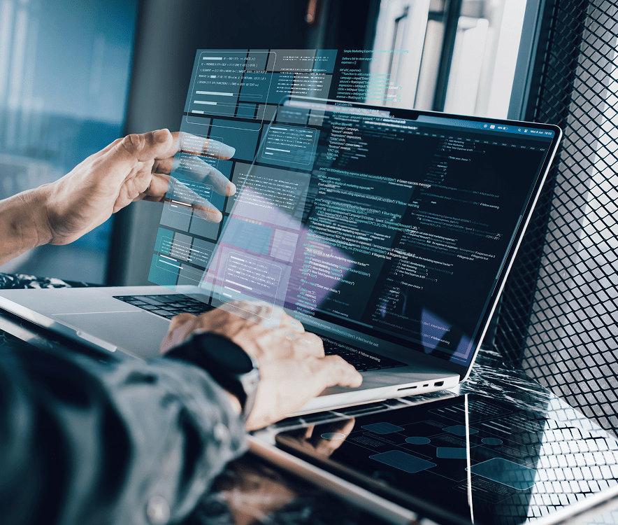 Person coding on a laptop